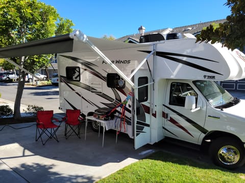 Four Winds set up at home with electric Awning 
6 chairs, Table, propane grill, 4 bike bike rack