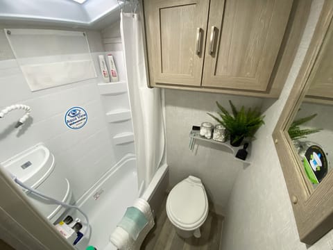 Full bath with ceramic toilet, shower and bathtub