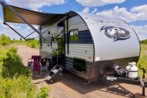 Exterior image of 2022 Forest River Wolf Pup 16BHS travel trailer with awning