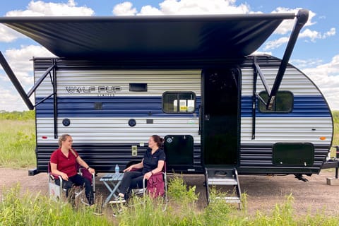 Exterior image of 2022 Forest River Wolf Pup 16BHS travel trailer with awning