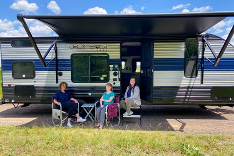 Exterior image of 2022 Forest River Grey Wolf travel trailer with awning