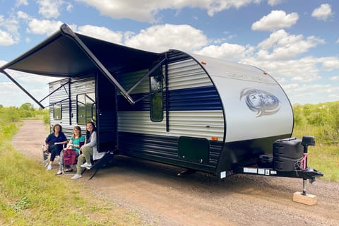 Exterior image of 2022 Forest River Grey Wolf travel trailer with awning