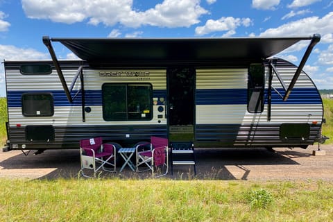 Exterior image of 2022 Forest River Grey Wolf travel trailer with awning