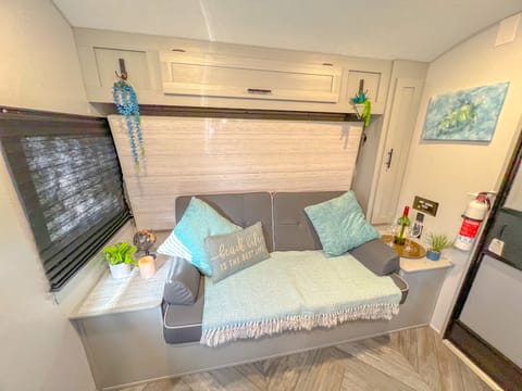 Sofa (queen murphy bed) for relaxing after a long day at the beach or enjoying time with family where ever the beach bunk takes you!! Saves space!