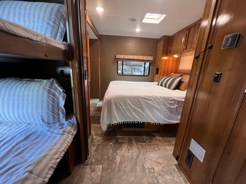 hallway with slide out bunks, and queen bed
