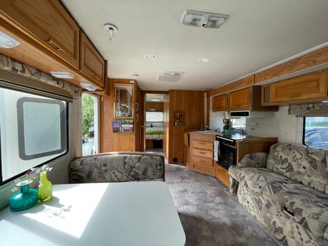 This RV features a pop out, giving you a ton of space. There is ample storage in the rig for your adventure supplies.