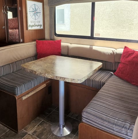 Dinette booth for dining and games. Not pictured are the 4 seatbelts under the cushions.