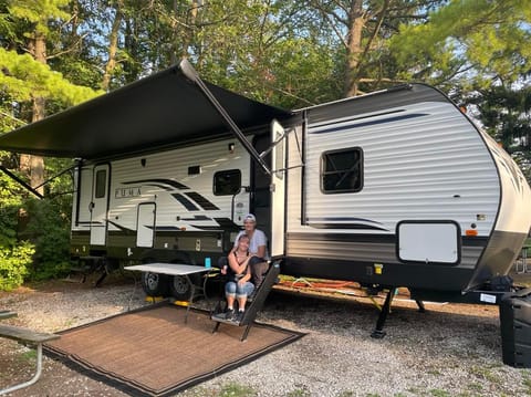 Double entry, external grill & fridge, safety rail & step grips on main entryway stairs (helpful for little ones). Brand new camper, modern & clean.