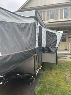 Exterior showing the dinette slide out. There is also an outside shower between the front bed and the dinette slide out.