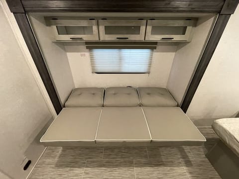 Extra storage above the couch/bed. 