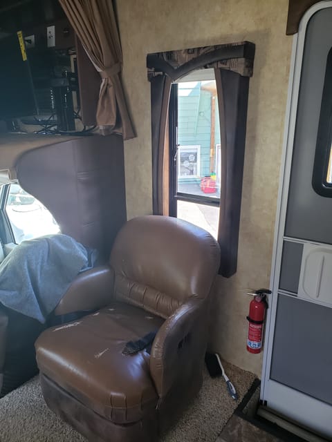 This chair is just inside the door and the passenger seat in the cab.