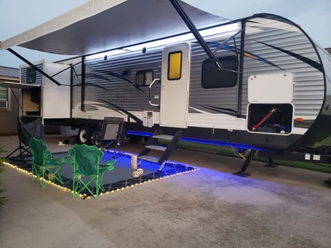 Lighted mat and camp chairs included (may not be chairs shown in picture).  Awning lighting and ground lighting both working.