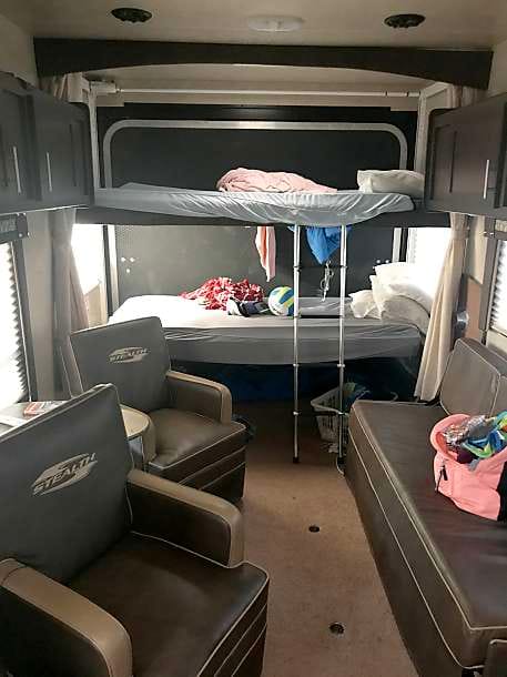 Dual full size beds with room underneath for Queen air mattress allowing more sleeping room.