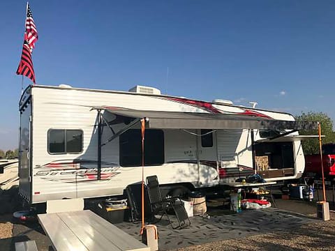 Awning extended with outdoor kitchen.