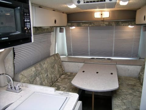 This Dinette folds down into a Full/Double- sized bed and is comfortable for 2. Seats 4 with seatbelts.