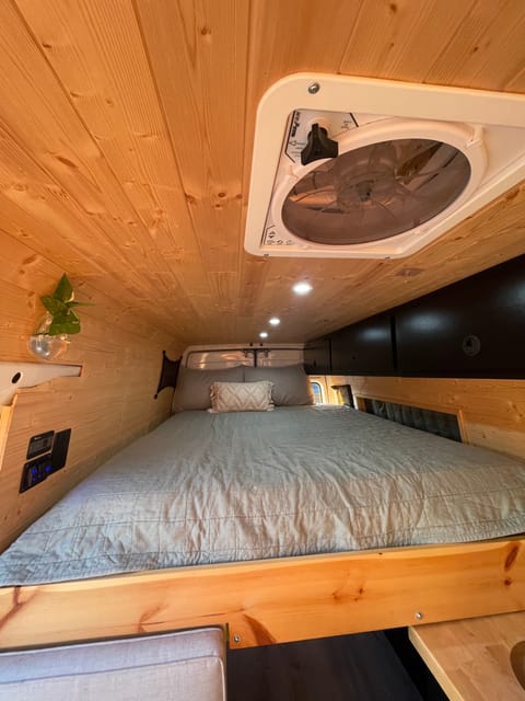 Overhead LED lights. Real Queen sized mattress with a memory foam topper! Cargo nets on each side give you easy bedside storage