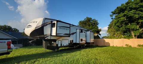 Beautiful BigHorn Traveler Fifth Wheel back view.  Two slides on front and 3 slides on back for a roomy interior.