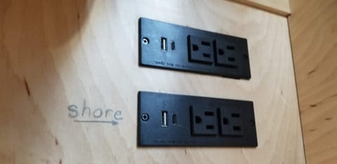 Several outlet options. The top row of outlets connects to the house batteries. The lower row of outlets connects directly to your shore power.