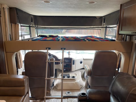 Over cab drop down bunk, captains chair will swivel around