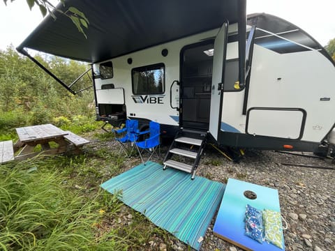 The Venture Vibe includes a push-button awning, outdoor griddle + fridge, 4X chairs & corn hole!