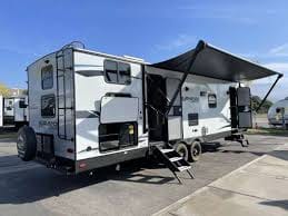 Outdoor kitchen, huge awning, and TWO entrances.