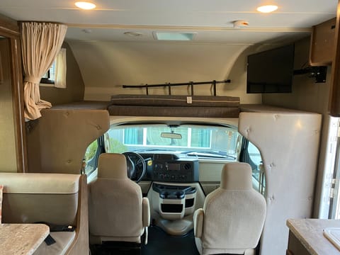 Driving cabin and upper full size bunk bed