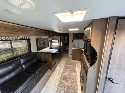 Beautiful interior with ample space to stretch your legs and enjoy a relaxing camping experience.