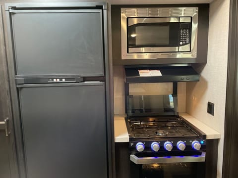 Microwave, stove, oven refrigerator. 