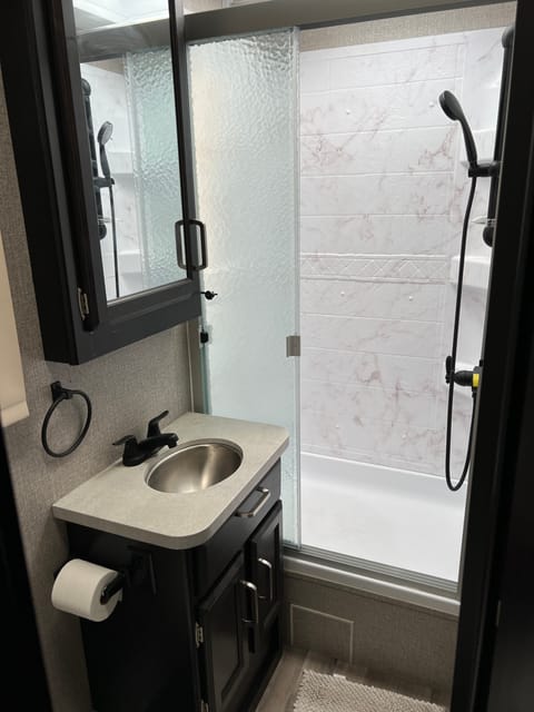 Bathroom with toilet and shower. 