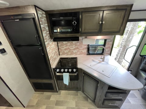 Kitchen - Microwave, 3 burner cook top, oven and refrigerator