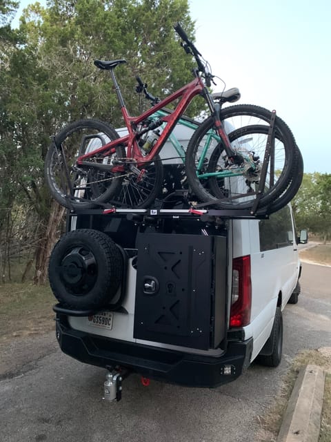 Rear can hold bikes and extra gear.