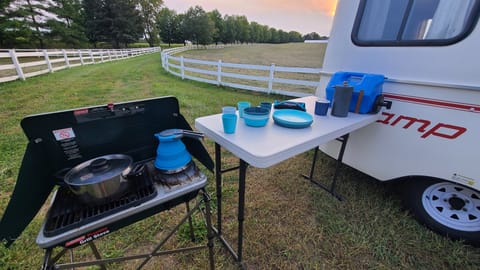 Outdoor kitchen provided (preferred to indoor cooking) along with coffee equipment, silverware, cooking utensils, etc.