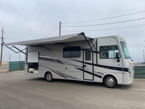Motorhome with awning out. 