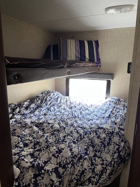Bunk fits one adult. Lower Full bed fits two adults. 