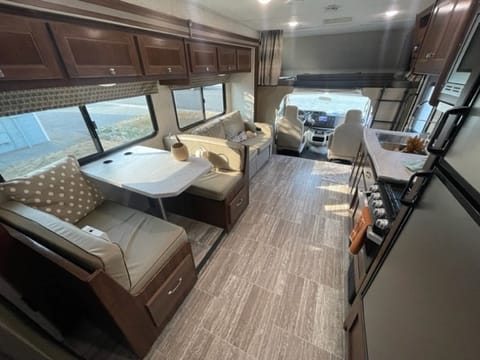 Living Area with Slide out. TV swings out from the bunk area over the cab