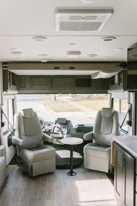 Beautiful views through this panoramic windshield. The road is yours. Swivel the seats around when parked, for a comfy area for conversation.
