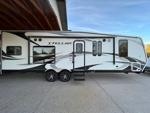 Broadside View features entrance doorway, electric awning, outdoor sound system, ample lighting and 110V GFCI outlet.