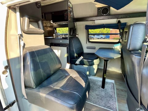 3 or 4 comfy captains chairs; 4th can be removed for paddleboard/snowboard storage. Driver and passenger chairs rotate to create great dining area.