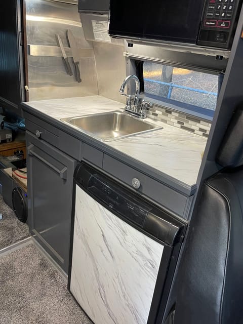 Roomy fridge with separate freezer. Lots of counter space. Induction stove stores away for more room. Great natural light and views  from the window 