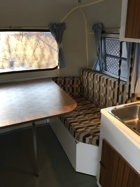 Comfortable seating for 4 adults. Storage under seats. Table lowers for a double bed.