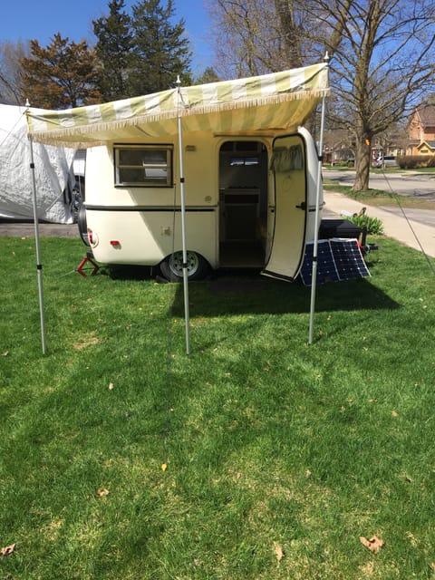 Large canopy with new telescopic poles and florescent guide ropes.  Great for extra shade and keeping dry in your lounge chairs.