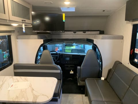 Dinette / bed with 2 seatbelts and large tv