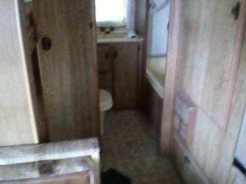 Full bathroom with sink, toilet, bathtub and shower.