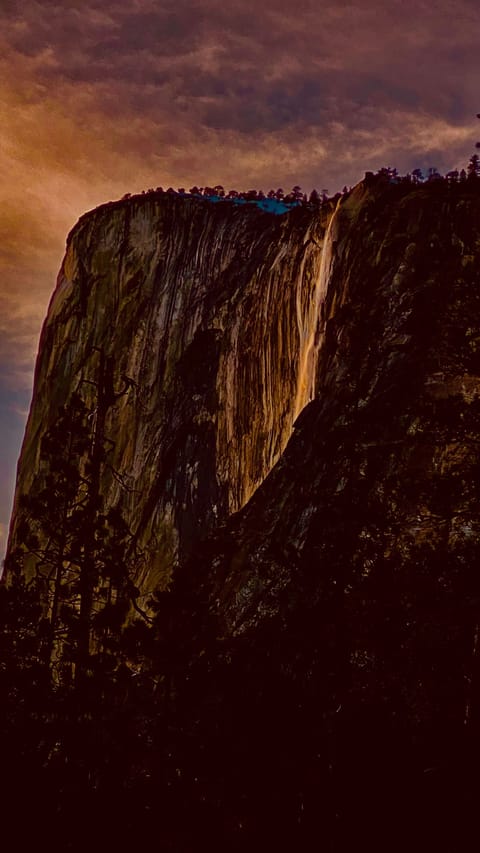 Yosemte Firefall. Happens yearly in Feb 15–Feb 28 each year.  At the time, Yosemite entry is limited by reservation or permit.  