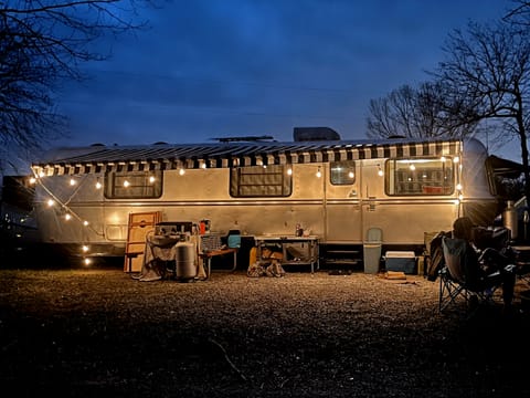 A peaceful night outside of our vintage trailer we call Reggie. Optional Add-On: Canopy Lights