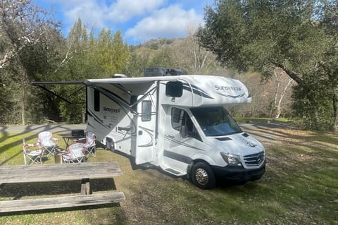 Camp is set up with propane gas grill, camp table, camp chairs, and optional Solo Stove fire pit.