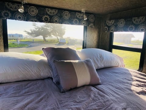 A room with an ocean view.  This is the rear slide-out queen size bed set up at Half Moon Bay SB.