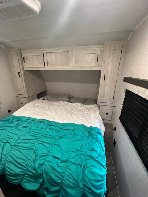 King Size bed in closed room with separate AC unit