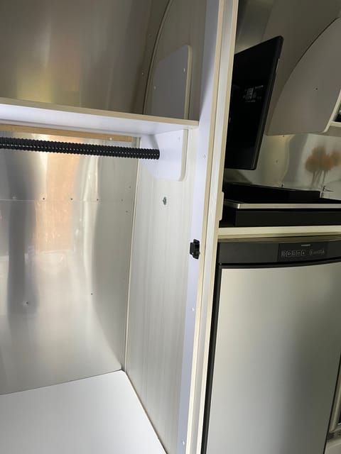 Cupboard and refrigerator.