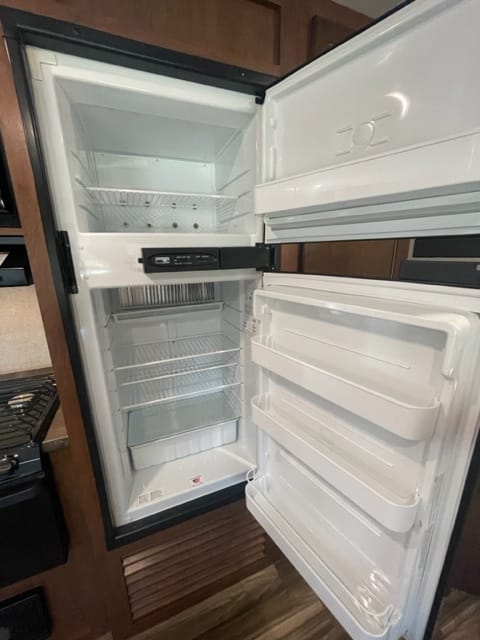 The refrigerator and freezer is convenient for your snacks and meals.